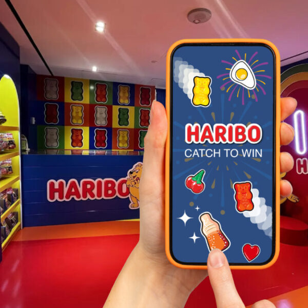 Colourful in-airport activation with a heart sign reading I love Haribo. Haribo has unveiled a new airport-wide activation around a 'Giant Wheel' game.