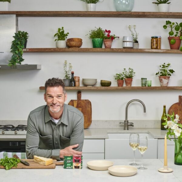 Fred Sirieix leans on the kitchen counter with his prepped veg, a couple of glass of wine and Knorr red wine stock pots. Stock brand Knorr stars celebrity maître'd Fred Sirieix in its newest campaign which highlights how the brand's stock pot range can save midweek meals.
