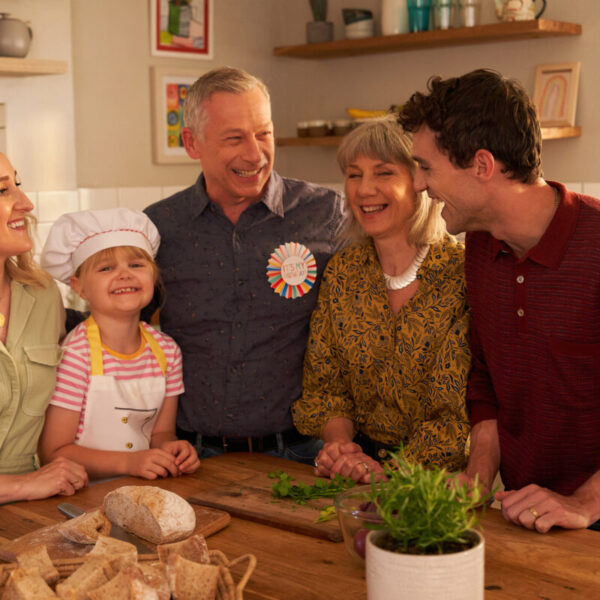 An image of the young girl Maya with her family around the table. Oxo's new campaign tells the story of a young girl making a meal for her grandfather with her dad as sous-chef as the Oxo cube saves the day.