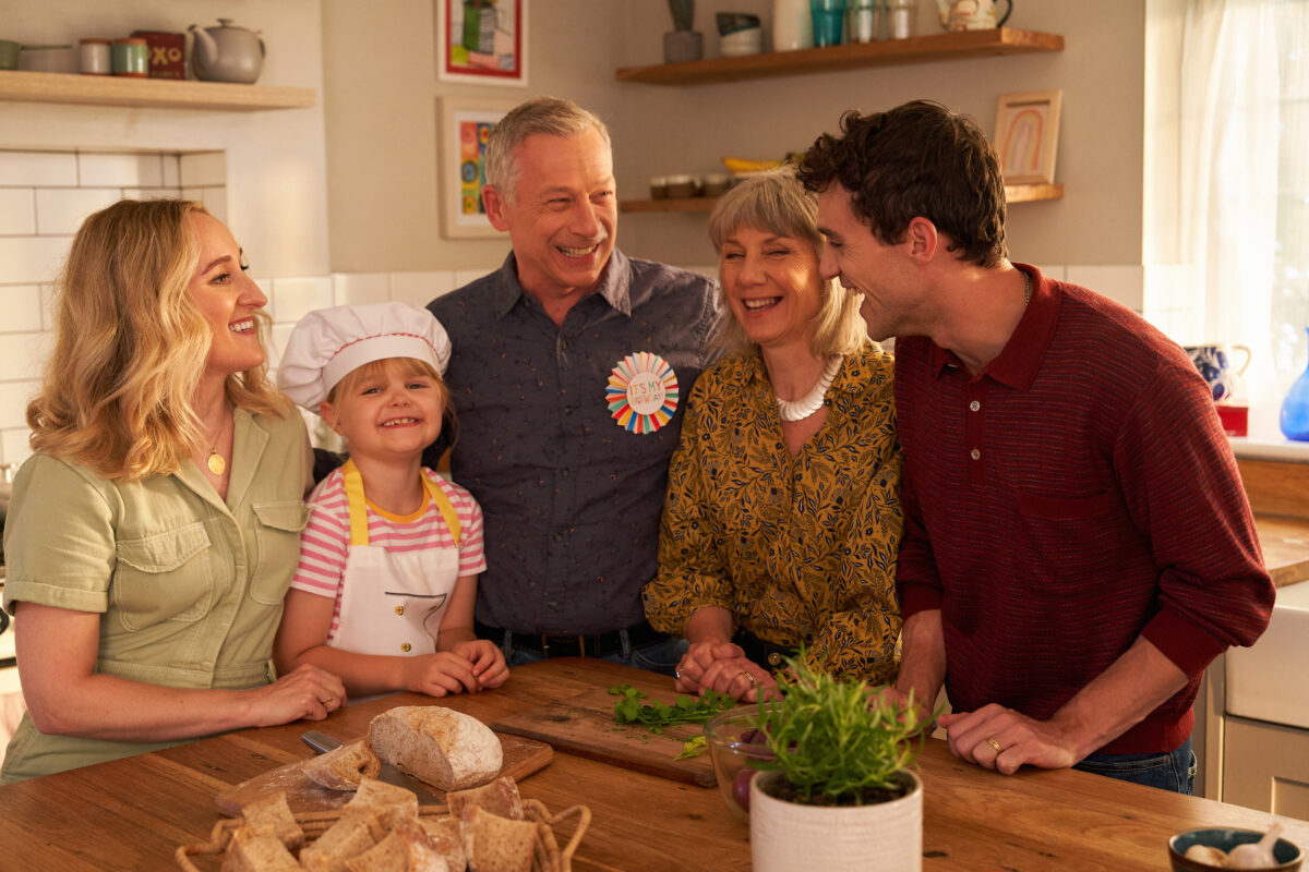 An image of the young girl Maya with her family around the table. Oxo's new campaign tells the story of a young girl making a meal for her grandfather with her dad as sous-chef as the Oxo cube saves the day.