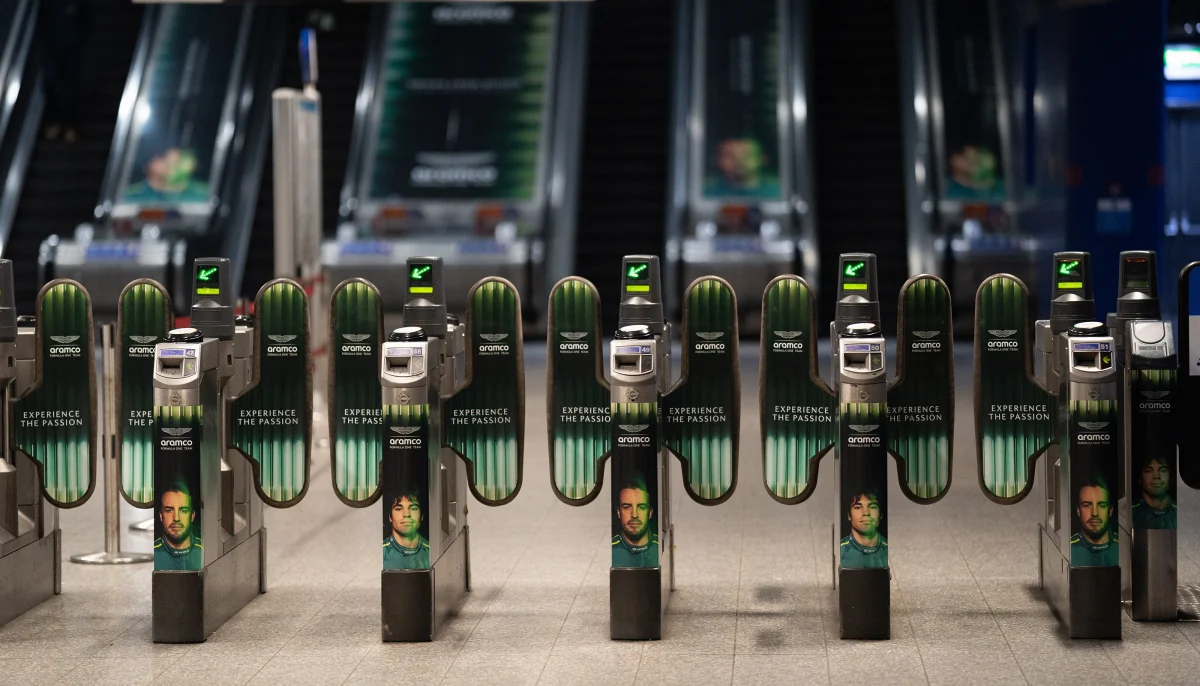 Aston Martin Aramco paints North Greenwich Tube station green