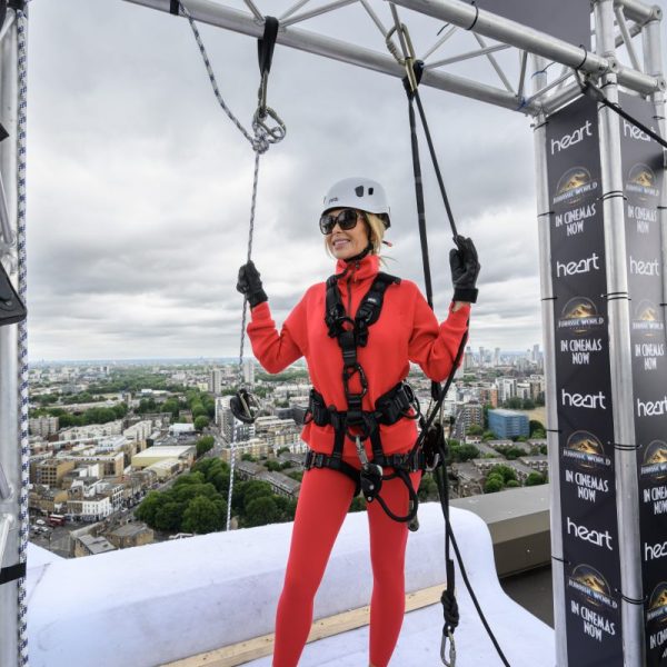 Heart Breakfast's Amanda Holden has abseiled down a 30-storey building in London to mark the release of Jurassic World Rebirth.