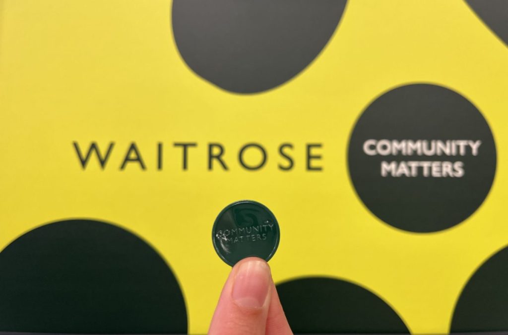 Waitrose is reinstating its green token charity scheme, which encourages customers to vote for a social cause.