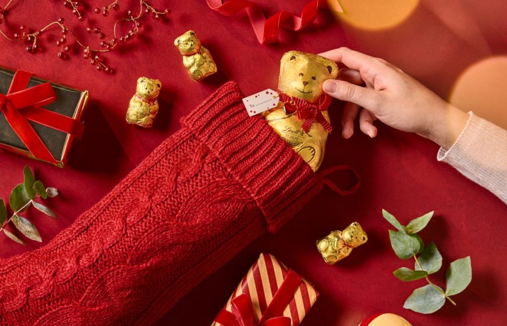 Swiss chocolatier Lindt is giving out free Lindt Teddys to anyone who brings a stocking to a participating store.